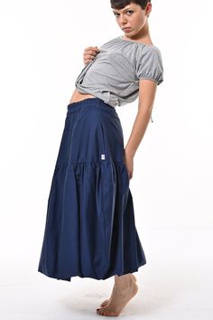 Tale: Make waves with this contemporary take on a 1850's puffball silhouette. Wear high in the waist or low as a hipster. The deep pockets are a great asset and the elasticated waist allows for expansion and comfort. Our model is 5ft 4" and wears an S with our Posey Top. Please see our size guide. 100% Cotton Skirt, 100% Polyester Lining Made in Britain 100% Woven Cotton Skirt, 100% Polyester Lining Wash at 30* Warm Tumble Dry Warm Iron Do Not Bleach Do Not Dry Clean Small Frocks, Stocking Fillers For Her, September Birthstone Jewelry, Navy Skirt, Make Waves, Street Design, Gifts For New Mums, Pearl Jewellery Earrings, Mens Jewelry Bracelet