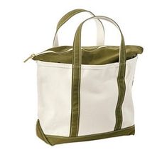 a white and green tote bag with two handles on the front, one is open