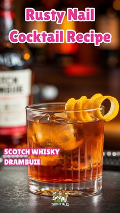 a close up of a glass of alcohol on a table with the words rusty nail cocktail recipe