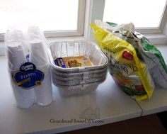 some food is sitting on the counter next to a bag and plastic wrap around it