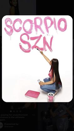 a woman painting the word scorpio san with pink paint