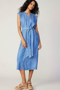 100% Tencel  Sleeveless v-neck button down midi dress with waist tie and large side pockets. V-neck Maxi Dress With Pockets For Daywear, Casual Sleeveless V-neck Dress With Tie Waist, Sleeveless Maxi Dress With Tie Waist For Daywear, Chic Midi Maxi Dress With Pockets, Daywear Belted Knee-length Midi Dress, Sleeveless Tie Fastening Maxi Dress For Daywear, Sleeveless Maxi Dress With Tie Fastening For Daywear, Knee-length Belted Midi Dress For Daywear, Chic Sleeveless Maxi Dress With Tie Fastening