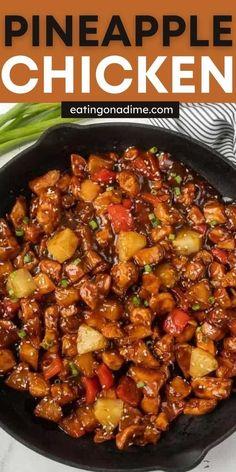 a skillet filled with pineapple chicken and garnished with scallions