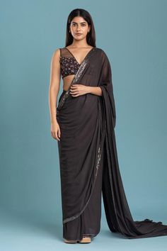 Mouse grey saree with embroidered border crafted in georgette. Paired with a floral embroidered padded blouse.
Components: 2
Neckline: V Neck
Sleeve Type: Sleeveless
Fabric: Georgette, Crepe
Color: Grey
Other Details: 
Attached lining
Back tie-up
Weight: Approx 1.2 kgs
Closure:
Saree: Button
Occasion: Sangeet - Aza Fashions Flower Saree, Grey Saree, Padded Blouse, Drape Saree, Embroidered Border, Blouse Design Models, Blouse For Women, Saree With Blouse, Georgette Sarees