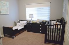 a baby's room with two cribs and a dresser