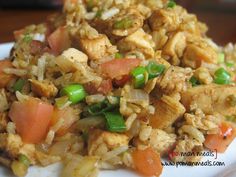 a white plate topped with rice and veggies