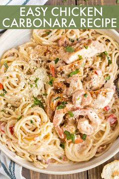 pasta with shrimp and parmesan cheese in a white bowl on a wooden table