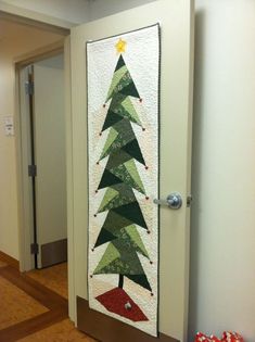 a decorated door with a christmas tree on it