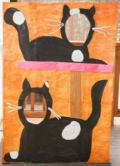 an art project made out of cardboard with two cats on the front and one cat on the back