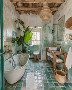 a bath room with a tub a sink and a mirror