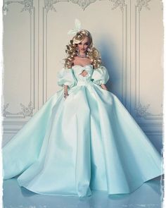 a barbie doll dressed in a blue gown