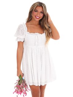 Embark on a new fashion journey with our New Adventure Mini Dress! This off white dress boasts embroidered eyelet detail, shirring front tie, and a back zip closure for easy dressing. Its lined construction and short sleeves with elastic and ruffled cuffs add a touch of comfort to its stylish design. Let this dress take you on a playful and unique style adventure! White Country Dress, Zack Bryan, Off White Dress, Kacey Musgraves, Country Dresses, Off White Dresses, New Adventure, Easy Dressing, New Adventures