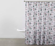 a shower curtain with christmas trees on it