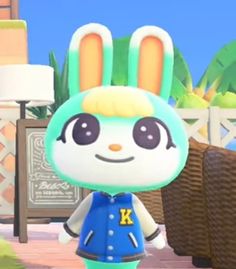 an animal crossing character is standing in the grass