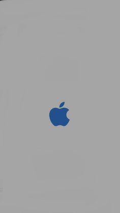 an apple logo on the side of a gray wall