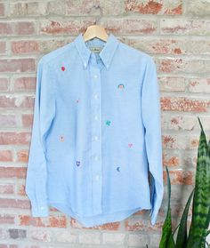 "Adorable hand-embroidered button-down from the Picky Stitches collection. Can you spot the theme? Each individual stitching pays homage to a favorite childhood cereal! Personally, we like the moon the best :) This piece has been upcycled with care and is in excellent condition. The original shirt is made by L.L. Bean. Labeled size L. Please see measurements for accurate fit: Length: 25\" Shoulders: 15.5\" Chest: 39\" Sleeve length: 24\" If you have any questions, please don't hesitate to send u Rose Skirt, Upcycled Clothing, Clothing Vintage, Vintage Velvet, Shirt Long Sleeve, Cute Skirts, Vintage Shirt, Upcycle Clothes, L L Bean