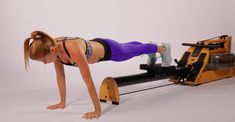 a woman doing push ups on an exercise machine