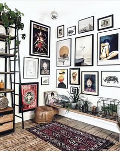 a room with pictures on the wall and an area rug in front of it that says instagram