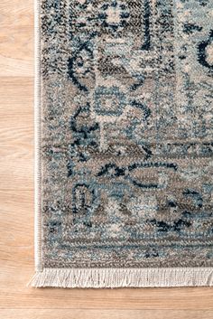 an area rug with blue and gray colors