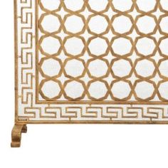 a gold and white decorative screen with an intricate design