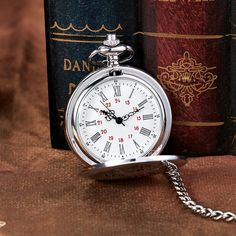 This pocket watch is crafted to meet the demanding needs of antique style accessories lovers. The dramatic antique-inspired finish makes this pocket watch look magnetizing. Made of stainless steel with intricate detailing, this fob watch has analog display and round casing. Order now!SpecificationsMovement: QuartzCase Material: Stainless SteelCase Shape: RoundDial Display: ANALOGFeature: pocket watchBezel Function: StationaryDial Window Material Type: AcrylicGender: UnisexItem Type: Pocket & Fob Silver Steampunk Pocket Watch With Metal Dial, Steampunk Silver Pocket Watch With Metal Dial, Vintage Stainless Steel Pocket Watch With Metal Dial, Vintage Stainless Steel Pocket Watch With Round Dial, Vintage Stainless Steel Pocket Watch, Classic Silver Metal Pocket Watch, Classic Metal Pocket Watch For Formal Occasions, Quartz Pendant Necklace, Fob Watch