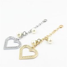 two necklaces with hearts and pearls on them