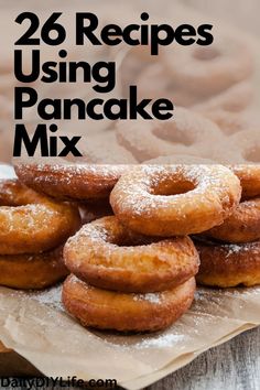 some sugared donuts are stacked on top of each other with the words 26 recipes using pancake mix