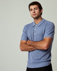 A pullover knitted sweater polo with complimentary contrast stitching at collar, pocket, sleeves, placket and bottom hem. Dress it up with a tailored jacked or keep it casual as you wear it solo. Details Models is 6'1" and wears a size medium. Care: Machine wash cold on delicate cycle with similar colors. Do not bleach. Do not tumble dry. Iron on low. Dry flat. Do not dry clean. Composition: 40% Viscose | 30% Recycled Polyester | 30% Nylon | 7DIAMONDS Men's Enzo Sweater Polo Shirt in Med Blue | Fitted Blue Polo Sweater With Short Sleeves, Fitted Short Sleeve Blue Polo Sweater, Fitted Blue Short Sleeve Polo Sweater, Blue Fitted Short Sleeve Polo Sweater, Casual Winter Polo Shirt With Ribbed Cuffs, Blue Casual Polo Sweater With Polo Collar, Relaxed Fit Collared Polo Sweater For Business Casual, Blue Casual Polo Sweater, Blue Cotton Polo Sweater For Workwear