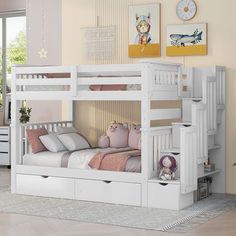 a white bunk bed with drawers underneath it in a child's playroom or bedroom