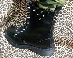 Perfect for any Rock 'N Roll outfit. Stylish black faux leather combat boots in women's size 8. Hand decorated with over 60 metal spikes. Lace and side zipper closure with memory foam insole. Leather Combat Boots, Metal Spikes, Faux Leather Boots, Combat Boot, Gothic Punk, Star Studs, Dr. Martens Boots, Rock N, Hand Decorated