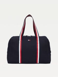 Tommy Hilfiger Womens Bag. Practicality And Standout Style Come Together In This Spacious Zip Tote, Showcasing Our Signature Stripes At The Handles For A Branded Finish. Sporty Rectangular Canvas Bag, Sporty Rectangular Cotton Bag, Sporty Canvas Bags For On-the-go, Sporty Canvas Gym Bag, Navy Sporty Bag With Zipper Closure, Sporty Navy Bag With Zipper Closure, Sporty Canvas Bag With Zipper Closure, Sporty Cotton Bags For Daily Use, Everyday Tommy Hilfiger Bag With Zipper Closure