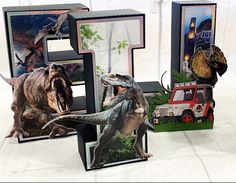 three different dinosaurs are shown in front of the letter e and an image of a dinosaur