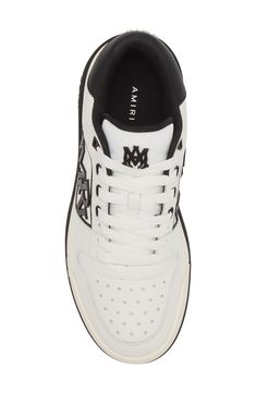 AMIRI adds a new sneaker to their lineup with this low-top style that features a rubberized logo detailing the mesh side wall and tiny star-shaped perforations. Lace-up style Removable insole Leather and synthetic upper/textile and leather lining/synthetic sole Imported Designer Shoes Tiny Star, Side Wall, New Sneakers, Classic Logo, Star Shape, Sneakers White, Up Styles, Low Top, Designer Shoes