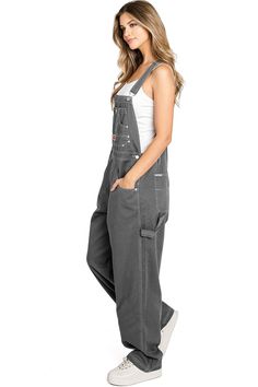 Multi-Pocket BibClassic twill canvas overalls with baggy straight leg fit. Traditional style bib with pockets on the chest and to the sides and button up closures on the sides. Pair with a crop top or long sleeve tee underneath! CARE | Hand Wash or Machine Wash Cold CONTENTS | 100% Cotton MEASUREMENTS | 56"/142 cm Top to Bottom 31"/78 cm Inseam (Size 14) MODEL | 5'8 - wearing a size 14; usual size is Small IMPORTED Plus Size Overalls, Womens Denim Overalls, Grey Denim, Denim Overalls, Tube Top, Long Sleeve Tee, Leotards, Traditional Style, One Piece Swimsuit