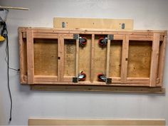 a wall mounted cabinet with tools in it