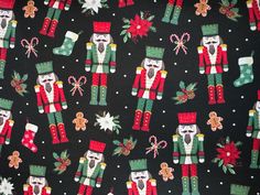 a black background with red and green nutcrackers, holly wreaths and snowflakes