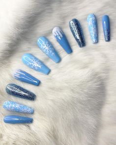 A gel polish, press-on nails set complete with light blue colors, glitter accents, snowflake detailing. Nail glue included in every purchase. Light Blue Snowflake Nails, Sparkly Christmas Nails, Nail Art Bleu, Blue Christmas Nails, Blue And Silver Nails, Snow Nails, Silver Nail Designs, Easter Nail Designs, Nude Nail Designs