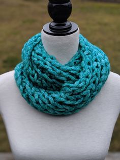 This chunky knit scarf that includes woven glitter yarn is the perfect gift for the mom in your life. This also makes a great gift for a friend who needs to stay warm. It would look great accessorizing your fall outfits as well. READY TO SHIP Color used on item Turquoise with silver specs  Acrylic Yarn Measurements of this item: (approximate) Circumference: 39 in Width: 8 in Material care: Machine wash GENTLE in cold water; Lay flat to dry. Do not bleach; do not iron. Handmade: Crochet in a smok Cozy Crochet Infinity Scarf, One Size Chunky Knit Yarn Knitting Pattern, Winter Gift Knitting Pattern, Yarn Knitting Pattern For Gifts, Handmade Knitting Pattern Yarn Gift, Winter Yarn Scarves For Gifts, Winter Yarn Scarves Gift, Winter Gift Yarn Scarves, Winter Gift Scarves In Yarn