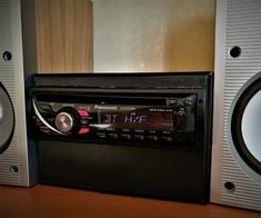 there is a radio and speakers on the table