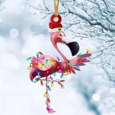 a flamingo ornament hanging from a tree with christmas lights on it's neck