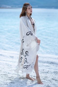 The Marrakesh Kimono Robe brings a touch of bohemian elegance to your wardrobe, crafted from 100% raw linen-look cotton in a natural hue with black woodblock prints. Hand-dyed with natural dyes, this kimono is gentle on the skin and eco-friendly. With a gender-neutral fit, side slits, and pockets, it’s perfect for lounging at home, beachwear, or making a statement at outdoor concerts and festivals. Fabric: 100% Raw Linen-Look Cotton Color: Natural with black woodblock print Size: One size fits m Paisley Kimono, Outdoor Concert, Boho Kimono, Dressing Gown, Woodblock Print, Beach Wears, Natural Dyes, Hand Dyeing, Gowns Dresses