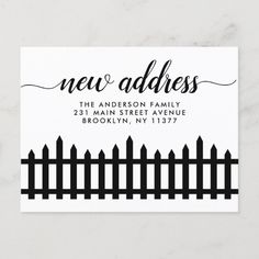 a black and white business card with the word new address on it, next to a fence