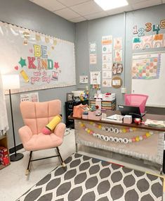 an office with two chairs and a desk in front of a chalkboard on the wall