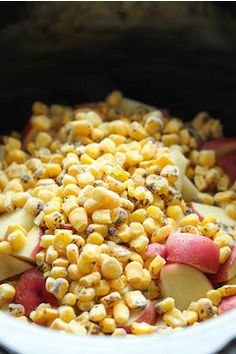 corn and apples are mixed together in the slow cooker