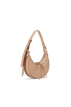 A smaller version of the original Selene hobo bag, the Selene Baby is crafted with an adjustable shoulder strap, contrast color detailing and a crescent silhouette. Matte camel calf leather bag with wine-color piping detail. Adjustable shoulder strap with matte wine-color details. Allows for shoulder and crossbody carry. Double zipper closure with leather tassel pulls and silver-tone hardware. Caramel leather interior with one interior pocket. Also available in Snow , Lava and Blush. Bag size: a Baby Camel, Adjustable Strap Bag, Expensive Bag, Brown Accessories, Soft Leather Bag, Wine Color, Leather Hobo Bag, Shopping Day