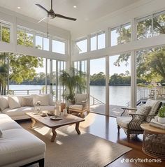 a living room filled with furniture and lots of windows