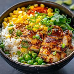 a bowl filled with rice, meat and vegetables