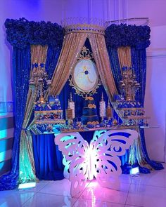 an elaborately decorated stage set up with blue and gold decor, including a clock