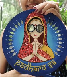 a woman holding up a plate with an image of a woman wearing glasses on it