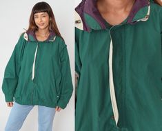 "Vintage 90s windbreaker jacket in green with beige and purple trim. Zips up the front wit a hood. Please see measurements and condition below. Every garment we sell is authentic vintage! You will receive the exact item photographed. Condition: Very good vintage. Best fits women's: Labelled Extra Large Tag: Bac Premier Material:  Cotton Polyester blend MEASUREMENTS Taken from seam to seam while the garment is lying flat. Double the armpit, waist, and hips For reference, model is 5'9\" and measur Retro Green Hooded Outerwear, Vintage Green Windbreaker For Streetwear, Vintage Green Windbreaker For Fall, Vintage Green Windbreaker For Winter, Vintage Green Windbreaker For Outdoors, Vintage Green Windbreaker For Outdoor, Vintage Green Winter Windbreaker, 90s Green Windbreaker For Spring, Green 90s Style Hooded Windbreaker